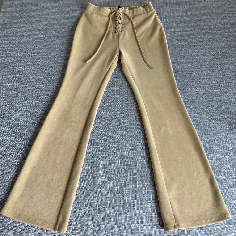 Forever 21 tan flare pants with lace up detail in a size 2